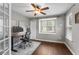 An organized office space with a modern adjustable desk, ergonomic chair, and natural light at 4020 New Salem Ct, Cumming, GA 30040