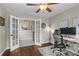 Inviting home office with French doors, a stylish desk, and modern decor at 4020 New Salem Ct, Cumming, GA 30040