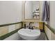 Charming powder room with a vessel sink, gold framed mirror, and stylish accents for a welcoming feel at 4020 New Salem Ct, Cumming, GA 30040