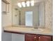 Well-lit bathroom sink and vanity area with dark wood cabinetry at 1504 Terminal Ct, Mcdonough, GA 30252