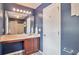 A blue bathroom featuring a vanity and a shower with a white shower curtain at 1504 Terminal Ct, Mcdonough, GA 30252