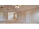 Spacious bedroom featuring neutral walls, carpeted floors, and a ceiling fan at 1504 Terminal Ct, Mcdonough, GA 30252