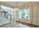Inviting entryway with wood-look tile flooring and staircase at 1504 Terminal Ct, Mcdonough, GA 30252