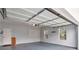 An empty garage with a door and two windows at 1504 Terminal Ct, Mcdonough, GA 30252