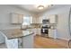 Bright kitchen with stainless steel appliances and granite countertops at 1504 Terminal Ct, Mcdonough, GA 30252