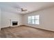 Spacious living room with fireplace and a large window allowing plenty of light at 1504 Terminal Ct, Mcdonough, GA 30252