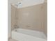 Standard bathtub with tiled wall, shower head, and faucet at 305 Mill Pond Se Ct, Smyrna, GA 30082