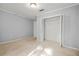 Sun-filled bedroom with neutral walls and closet with open doors at 305 Mill Pond Se Ct, Smyrna, GA 30082