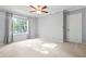 Bright bedroom with plush carpet, neutral walls, and natural lighting at 305 Mill Pond Se Ct, Smyrna, GA 30082