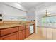 Close-up of kitchenette area with wooden cabinets and granite countertops at 305 Mill Pond Se Ct, Smyrna, GA 30082