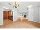 Open living space with hardwood floors, dining area, and fireplace at 305 Mill Pond Se Ct, Smyrna, GA 30082