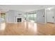 Spacious living room featuring a fireplace, hardwood floors, and natural light from large windows at 305 Mill Pond Se Ct, Smyrna, GA 30082