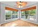 Bright living room with natural light streaming through windows and a unique ceiling fan at 305 Mill Pond Se Ct, Smyrna, GA 30082
