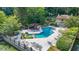 Community pool and lounging area with chairs and umbrellas at 305 Mill Pond Se Ct, Smyrna, GA 30082