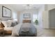 Serene bedroom featuring a bed with plush pillows, complemented by modern lighting and decor for a relaxing atmosphere at 5210 Davenport Pl, Roswell, GA 30075