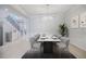 Elegant dining room with modern chandelier, seating for six, and staircase in the background at 5210 Davenport Pl, Roswell, GA 30075