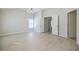 Expansive living room with light wood floors and multiple doorways, offering seamless flow and a versatile space at 5210 Davenport Pl, Roswell, GA 30075