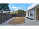 Fenced backyard featuring a concrete patio with a small grass area at 6515 Bentley Ridge Dr, Cumming, GA 30040