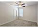 This bedroom features carpeted floors, a ceiling fan, and lots of natural light at 6515 Bentley Ridge Dr, Cumming, GA 30040