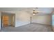 Large, carpeted bonus room with plenty of natural light and high ceilings at 6515 Bentley Ridge Dr, Cumming, GA 30040