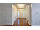 Inviting foyer with hardwood floors, recessed lighting, and an arched entryway, creating a welcoming ambiance at 6515 Bentley Ridge Dr, Cumming, GA 30040