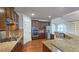 Modern kitchen with stainless steel appliances, granite countertops, and ample cabinet space for storage at 6515 Bentley Ridge Dr, Cumming, GA 30040