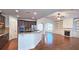 Open kitchen featuring granite countertops, stainless steel appliances, and views of the living area at 6515 Bentley Ridge Dr, Cumming, GA 30040