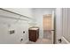 The laundry room features a utility sink and built in shelving at 6515 Bentley Ridge Dr, Cumming, GA 30040
