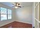 Bright office with hardwood floors, a large window, and a door leading to an adjacent room at 6515 Bentley Ridge Dr, Cumming, GA 30040