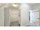 Spacious walk-in closet with built-in shelving, drawers, and carpet at 6515 Bentley Ridge Dr, Cumming, GA 30040