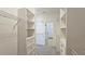 Well-organized walk-in closet with adjustable shelving, drawers, and ample storage space at 6515 Bentley Ridge Dr, Cumming, GA 30040