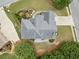 Aerial view of the home's roof, driveway, and landscaping, with surrounding trees at 200 Glen Wood Place, Canton, GA 30114