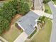 Aerial view showcasing roof, manicured landscaping, and the driveway of the residence at 200 Glen Wood Place, Canton, GA 30114