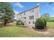 Spacious backyard with a deck, stairs, well-maintained lawn, and mature trees at 200 Glen Wood Place, Canton, GA 30114