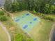 Aerial view of basketball court showcasing a well-maintained outdoor recreational space with trees all around at 200 Glen Wood Place, Canton, GA 30114