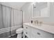 Bathroom featuring a sleek vanity with modern fixtures, a toilet, and a shower with a curtain at 200 Glen Wood Place, Canton, GA 30114