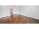 Bedroom featuring hardwood floors, closet, and a modern light fixture at 200 Glen Wood Place, Canton, GA 30114