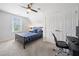 Comfortable bedroom with a cozy bed, plush carpeting, a window, and a dedicated workspace at 200 Glen Wood Place, Canton, GA 30114