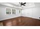Spacious bedroom with hardwood floors, large windows, ceiling fan, and tray ceiling at 200 Glen Wood Place, Canton, GA 30114
