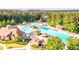 Aerial view highlighting the expansive community pool complex, complete with multiple pools, slides, and a lounge area at 200 Glen Wood Place, Canton, GA 30114