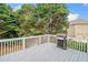 View of the deck, featuring white railings and a grill for outdoor cooking and entertaining at 200 Glen Wood Place, Canton, GA 30114