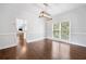 Spacious dining room with hardwood floors, natural light, and stylish light fixture at 200 Glen Wood Place, Canton, GA 30114