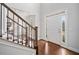 Bright foyer features hardwood floors, staircase with wood and iron railing, and natural light at 200 Glen Wood Place, Canton, GA 30114