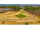 Beautiful view of the golf course on a partly cloudy day with golfers and golf carts visible at 200 Glen Wood Place, Canton, GA 30114