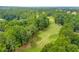 Scenic view of the well-maintained golf course surrounded by lush green trees at 200 Glen Wood Place, Canton, GA 30114