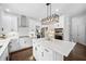 Modern kitchen featuring stainless appliances, a quartz island, and custom cabinetry at 200 Glen Wood Place, Canton, GA 30114