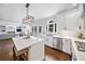 Modern kitchen with white cabinetry, stainless steel appliances, and a large center island with seating at 200 Glen Wood Place, Canton, GA 30114