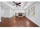 Cozy living room with hardwood floors, a fireplace with stone accents, and built-in shelving at 200 Glen Wood Place, Canton, GA 30114