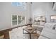 Living room features lots of natural light, hardwood floors, and open floor plan at 200 Glen Wood Place, Canton, GA 30114