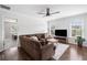 Inviting living room with a cozy sofa, dark wood floors, and bright windows offering picturesque views at 200 Glen Wood Place, Canton, GA 30114